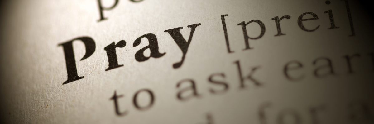 Close-up of the word prayer in a Bible, representing how to pray when you don’t know what to say